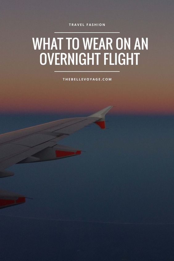 an airplane wing with the words travel fashion what to wear on an overnight flight