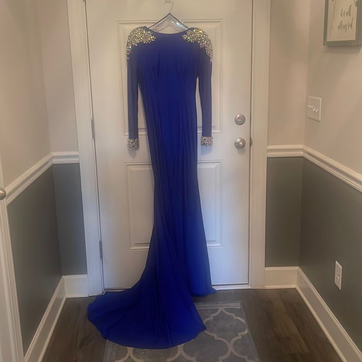 Never Worn. No Alterations. Still Has Tags. Royal Blue Long Sleeve Evening Dress, Royal Long Sleeve Fitted Dresses, Royal Long Sleeve Fitted Gown, Royal Fitted Evening Dress, Royal Blue Fitted Evening Gown, Royal Blue Long Sleeve Evening Dress For Gala, Royal Blue Long Sleeve Evening Gown, Royal Long Sleeve Formal Dresses, Blue Long Sleeve Dress For Gala