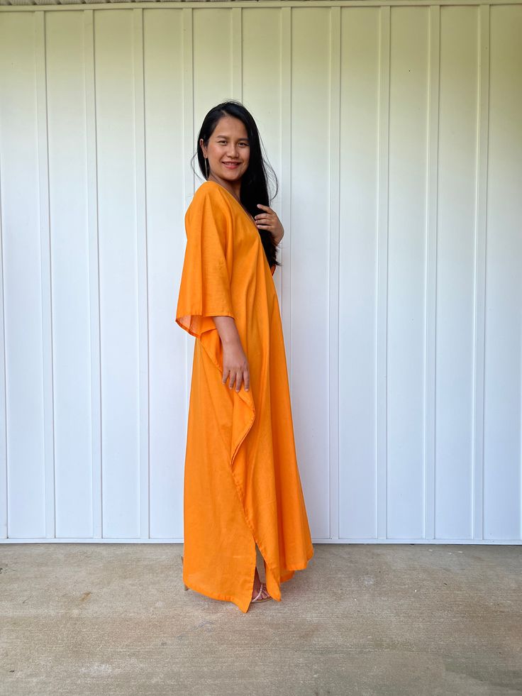 Unwind in absolute comfort with our semi sheer cotton gauze kaftan. This kaftan is perfect for the beach, pool, resort and laid-back time at home. Crafted from quality soft and breathable gauze cotton, it offers an airy fit that's ideal for lounging and cover up. Its relaxed design and easy slip-on style make it your go-to choice for outdoor cover up and relaxed nights at home. Long Summer Cover-up With Relaxed Fit, Flowy Lounge Tunic With Kimono Sleeves, Flowy Kimono Sleeve Tunic For Loungewear, Summer Kimono For Lounging With Relaxed Fit, Orange V-neck Kimono For The Beach, Breezy Flowy Maxi Dress For Loungewear, Summer Maxi Kaftan For Daywear, Beachwear Kaftan With Kimono Sleeves For Daywear, Summer Tunic Kaftan For Daywear