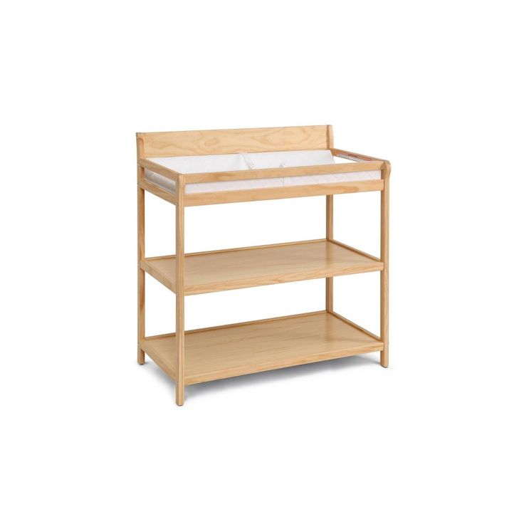 a wooden baby changing table with two shelves on each side and one shelf below it