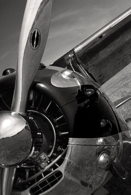 an old propeller airplane parked on the tarmac with its blades still attached to it