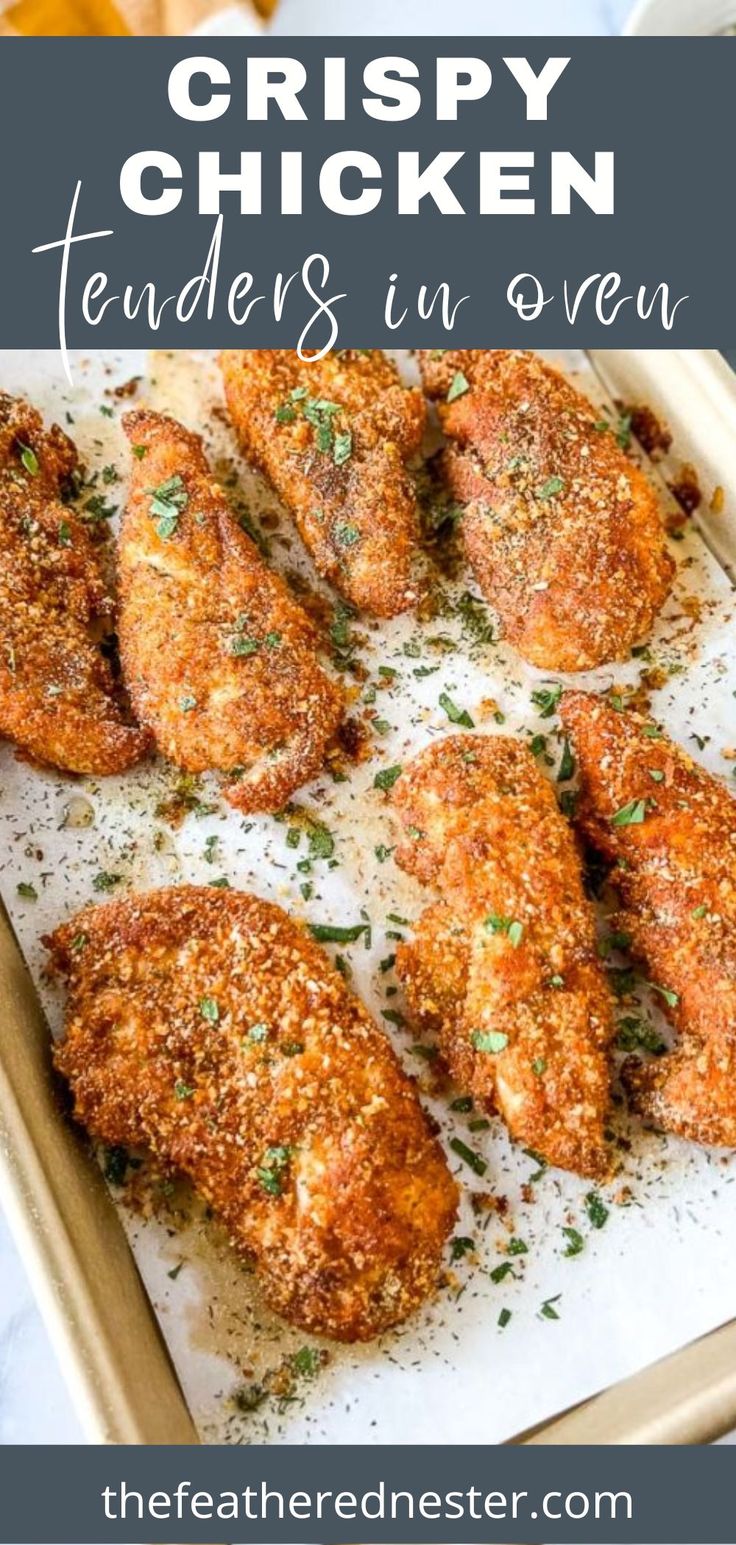 crispy chicken tenders in oven on a baking sheet