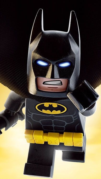 the lego batman movie character has blue eyes and is standing in front of a yellow background