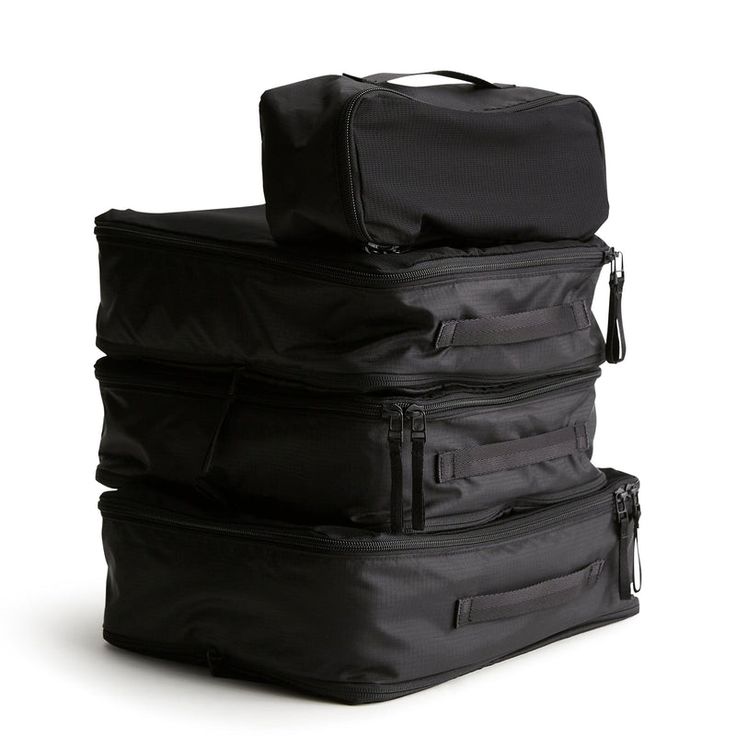 Simplify your travel experience with our Packing Cube Set. Designed to maximize space and organization in your suitcase or travel bag, these cubes offer a convenient solution for keeping your clothes and accessories neatly separated and easily accessible during your journey. Streamline your packing process and stay organized on your next trip with our Packing Cube Set. Whether you're embarking on a weekend getaway or a globetrotting adventure, our cubes make it easy to pack efficiently and stay Versatile Nylon Luggage For Trips, Practical Black Nylon Luggage, Functional Travel Bag With Luggage Sleeve For Organization, Practical Black Travel Accessories For Overnight Trips, Functional Black Travel Accessories For Overnight Trips, Multifunctional Black Travel Accessories For Storage, Packable Functional Travel Accessories For Everyday, Packable Nylon Travel Accessories For Trips, Black Packable Rectangular Travel Accessories