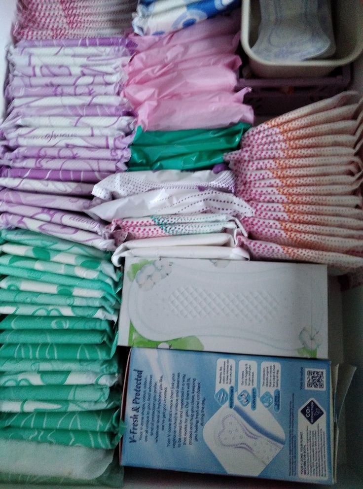 the drawer is filled with many different types of diapers