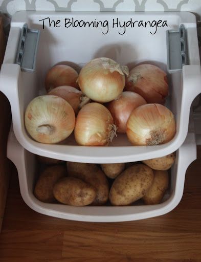 there are onions and potatoes in the bin