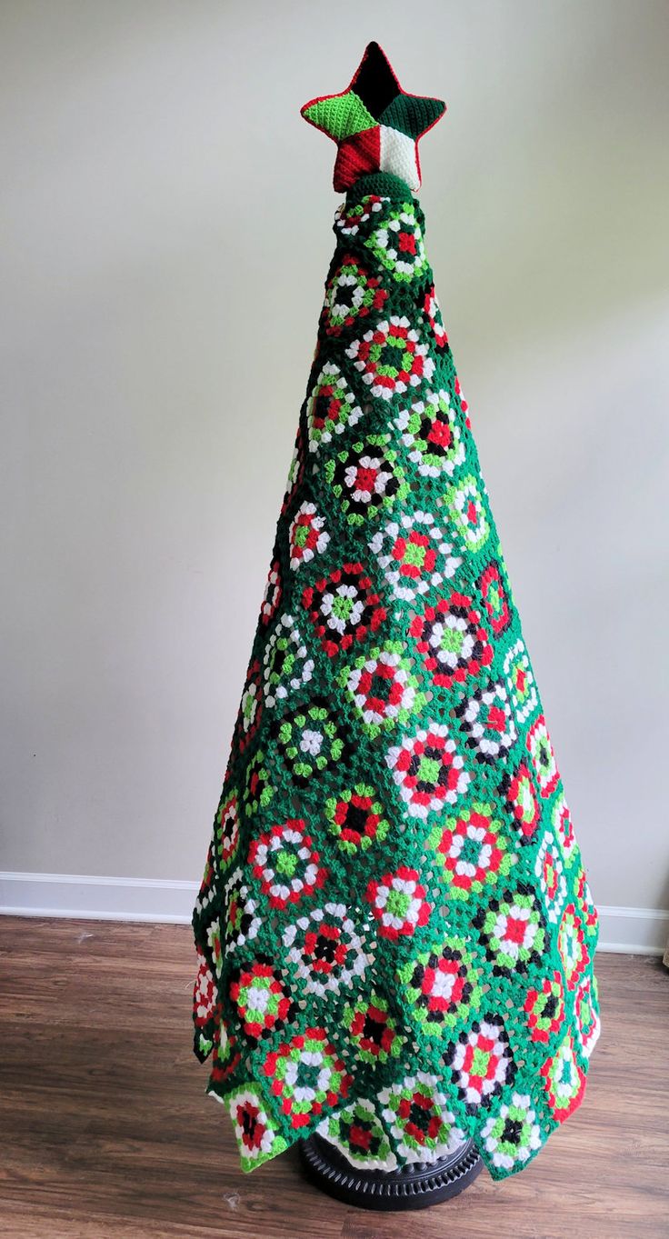 a crocheted christmas tree with a star on top