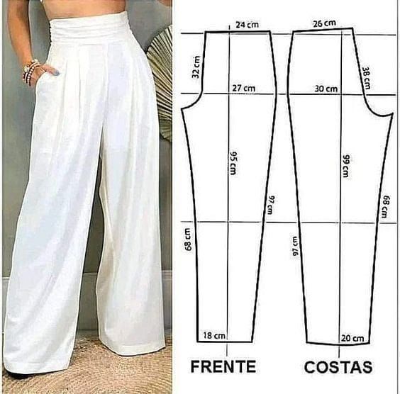 a woman in white pants and cropped top is standing next to the size chart for her