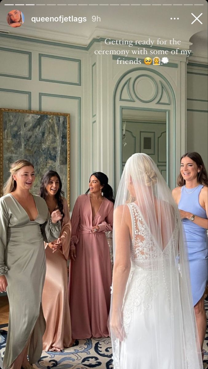 a group of women standing next to each other in front of a mirror