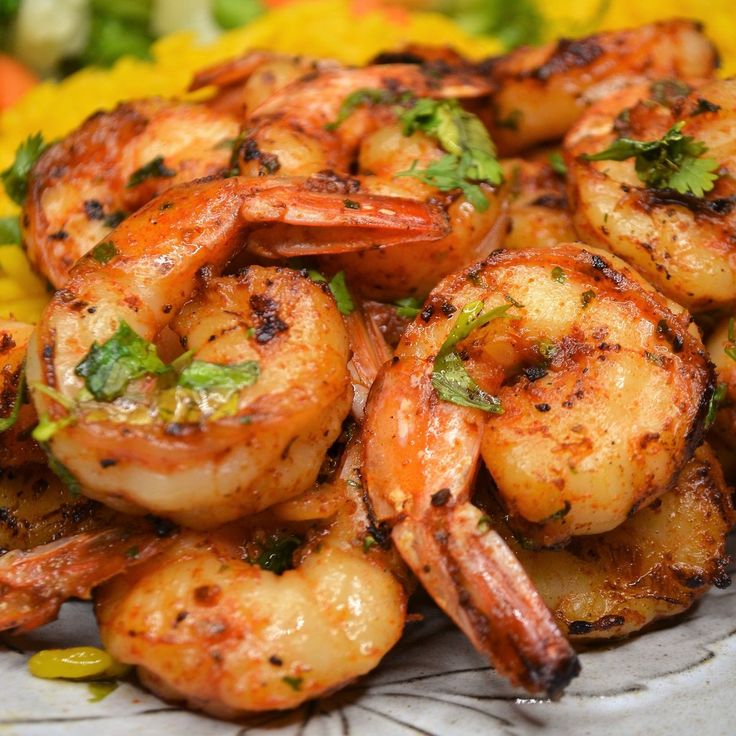 grilled shrimp with herbs on a plate