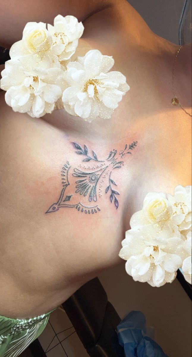 a woman with white flowers on her stomach