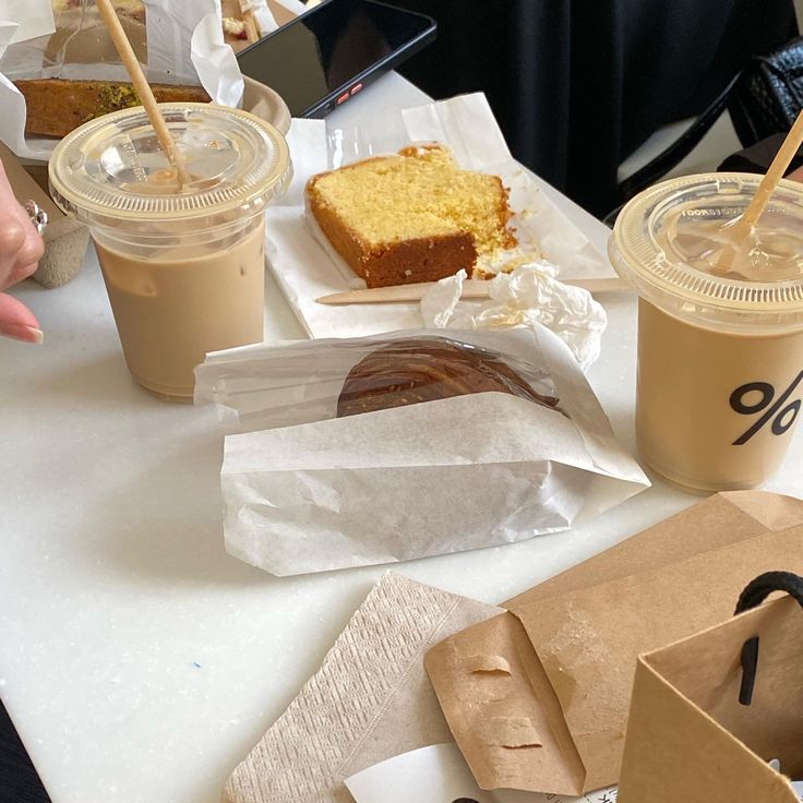 a table topped with lots of different types of food and drinks next to each other