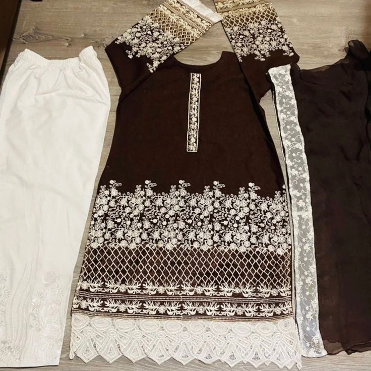 Pakistani India Brand New 3 Piece Front Embroidery With Fancy Lace And Embroidery Trousers And Chiffon Lace Dupatta Ready To Wear Size Medium To Large Elegant Embroidered Brown Dress, Festive Brown Embroidered Dress, Elegant Brown Embroidered Dress, Elegant Brown Dress With Intricate Embroidery, Festive Brown Dress With Intricate Embroidery, Party Kurta With Floral Embroidery In White, White Kurta With Floral Embroidery For Party, Spring Dresses With Cutwork Unstitched, Elegant Embroidered Brown Kurta