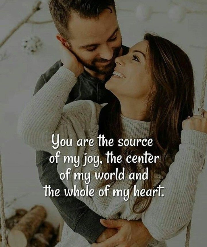 a man holding a woman in his arms with the words you are the source of my joy, the center of my world and the whole of my heart