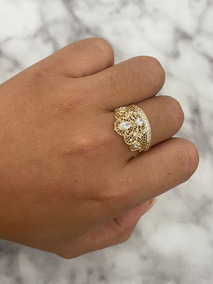 -100% 14k gold  -24/7/365 wearable  -size 7  -sizing upon request  -will not tarnish, nor change color  -let us know any questions  -item sold buy piece. Weight is undetermined Gold Dome Ring With Vs Clarity, Gold 14k Stamped Filigree Ring, Gold Filigree Ring Stamped 14k, Elegant Gold Engraved Ring With Diamond Accents, Exquisite Gold Ring For Anniversary, Gold Wide Band Jewelry With Prong Setting, Elegant Gold Plated Wide Band Ring, Gold Rings With Vvs Clarity, Heirloom Style Gold Cubic Zirconia Rings