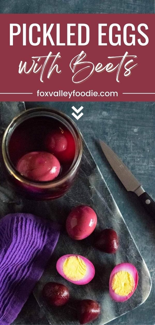 pickled eggs with beets on a cutting board next to a purple mitt