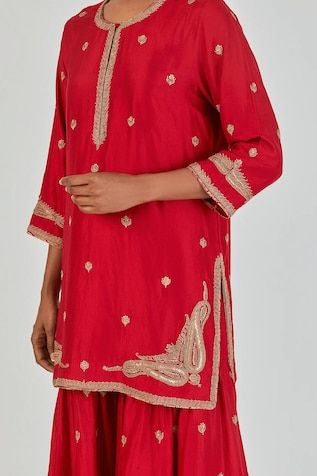 Red A-line silk kurta featuring three fourth sleeves and wild floweret Marodi buta embroidery with gold zari thread work. Paired with a matching sharara for a complete look., Fit: Relaxed Elegant Red Straight Kurta Traditional Wear, Designer Festive Sets With Gota Work, Elegant Red Palazzo Set With Chikankari Embroidery, Elegant Designer Red Palazzo Set, Elegant Red Designer Palazzo Set, Elegant Red Blouse Piece For Eid, Designer Sets With Gota Work For Festivals, Fitted Red Palazzo Set With Gota Work, Red Fitted Palazzo Set With Gota Work