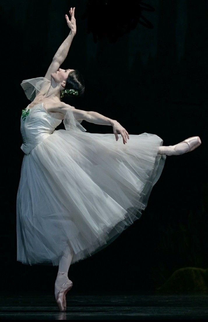 the ballerina is wearing a white tulle skirt