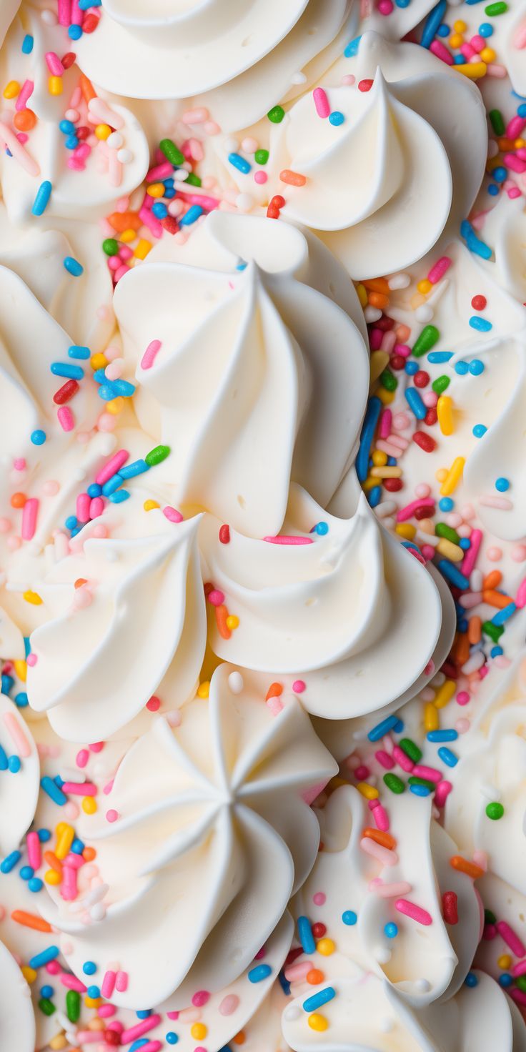 sprinkles and white frosting are scattered on the surface