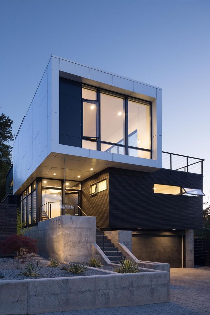 a modern house with stairs leading up to it