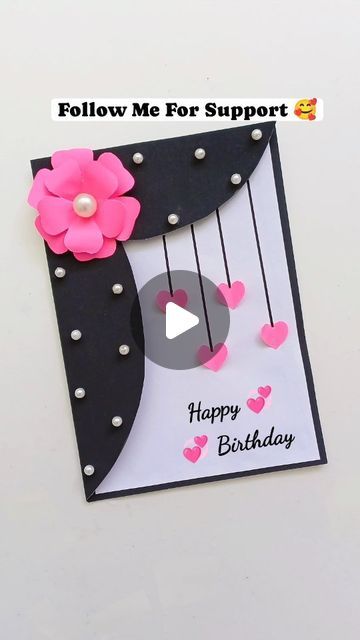 a birthday card with pink flowers on it