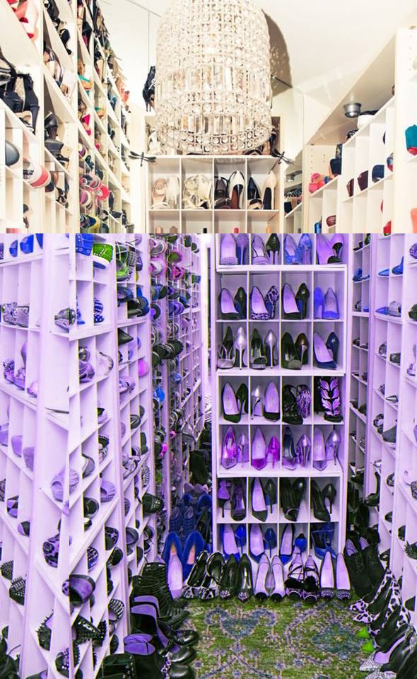 a closet filled with lots of shoes next to a wall covered in white shelving