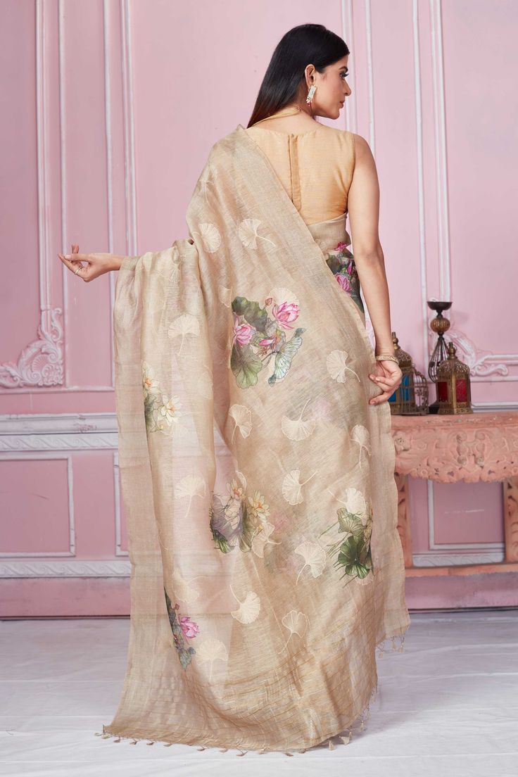 Elegant beige floral print Banarasi saree is a perfect drape for light festive occasions. It comes with a blouse piece. Disclaimer: The shown stitched blouse on the model is for display purpose only. The saree comes with a matching blouse piece and finished with fall and piko. Latest Designer Sarees, Fashion Journals, Banarasi Saree, Traditional Fabric, Saree Online, Designer Sarees, Banarasi Sarees, Look Your Best, Sarees Online