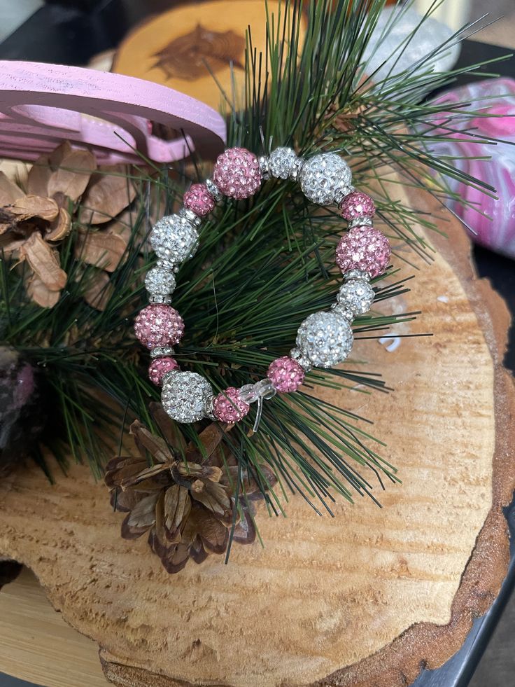 Description This stylish Pink & White Round Rhinestone Beaded Elastic/Stretch Bracelet is perfect for any fun-loving fashionista who enjoys making a statement. Blending classic elastic and sparkling rhinestones with acrylic beads, this bracelet is sure to turn heads! Shine on! Details Strand Length: 7" Bead Length: 2.5mm - 11.5mm Bead Width: 5.5mm - 12.5mm Acrylic Round Beads encrusted with Pink & White rhinestones Features One of a kind, fashion jewelry, everyday jewelry Great gift for that spe Adjustable Pink Crystal Bracelet With Sparkling Stones, Pink Crystal Bracelet With Rhinestones, Pink Adjustable Crystal Bracelet With Rhinestones, Adjustable Pink Crystal Bracelet With Rhinestones, Adjustable Crystal Bling Bracelet, Pink Rhinestone Beaded Bracelet As Gift, Crystal Bracelet With Rhinestones And Round Beads, Crystal Bracelet With Round Rhinestones, Beaded Crystal Stretch Bracelet