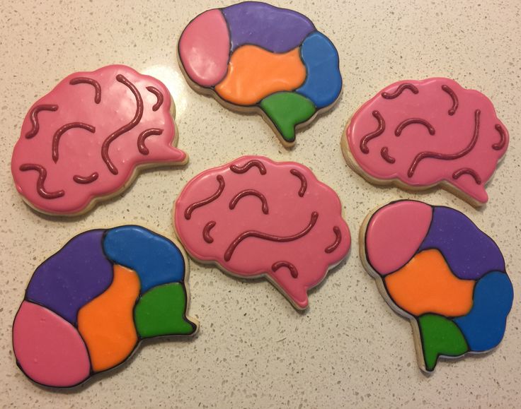 four decorated cookies in the shape of brain sections