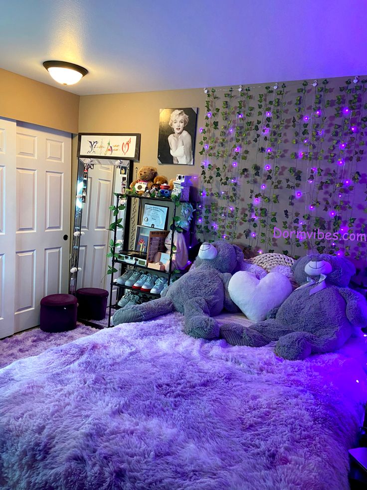 a bedroom with purple lights and teddy bears on the bed