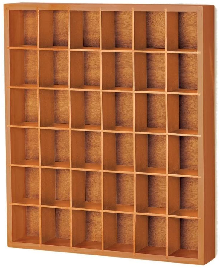 a wooden shelf with many compartments on it