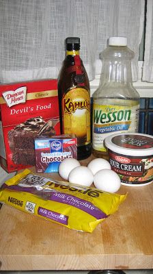 ingredients to make chocolate cake sitting on a counter next to a bottle of milk and eggs