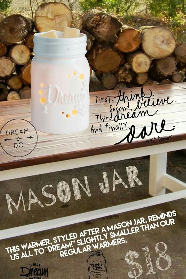 a mason jar sitting on top of a wooden bench next to firewood stacked in the background