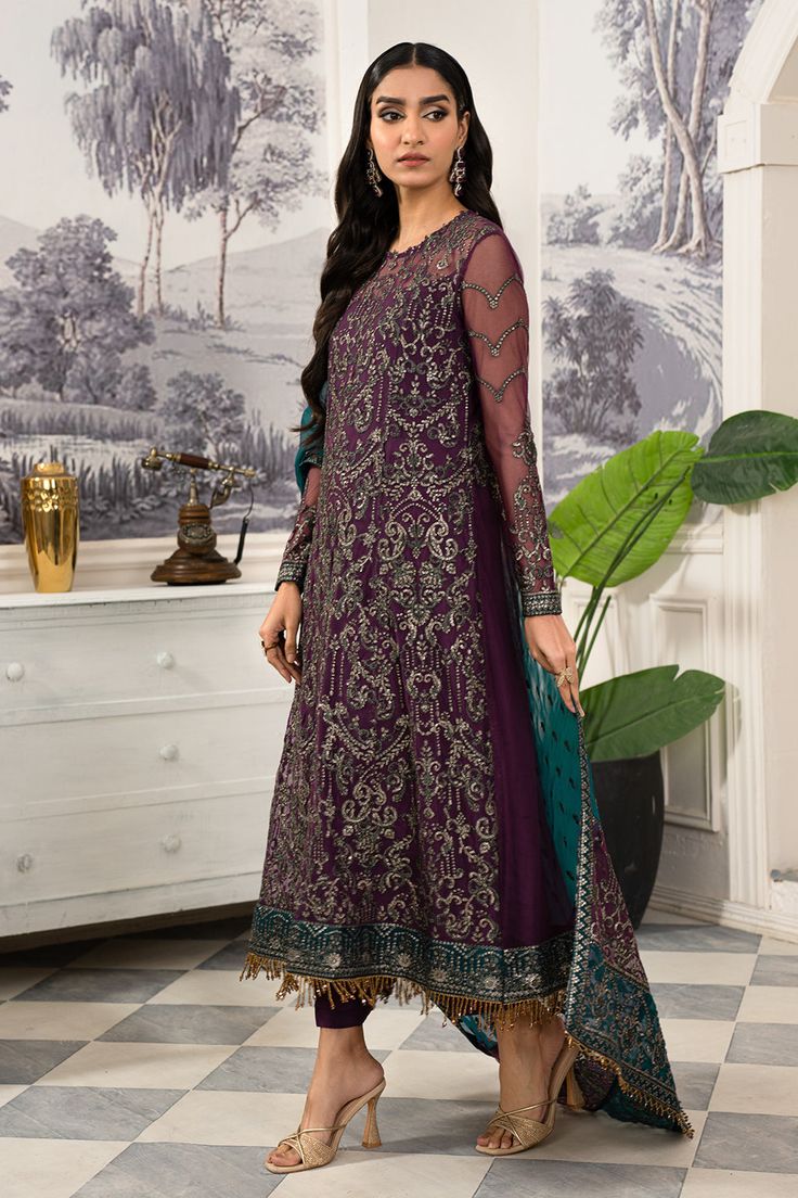 Luxury Purple Shade Embroidered Pakistani Salwar Kameez Dupatta Suit has an alluring gold shade that will give you a head-turning look on the big day. Zari details and sequins give a chic look to the Pakistani Salwar Suit. Embroidered Kameez: The Purple kameez in the Organza fabric is emblazoned with luxury designs. Floral motifs and hand-worked embroidery make this beautiful kameez in purple a perfect choice to wear at the wedding. The borders and neckline of this organza kameez are also adorned with intricate designs. Salwar Kameez Trouser: The embroidered purple kameez is paired with trousers to create a lavish Pakistani traditional Dress. The organza trousers are perfectly stitched and adorned with lining details, making them a lavish choice to pair with the embroidered kameez. Organza Dusk Dress, Asim Jofa, Chiffon Shawl, Readymade Saree, Pakistani Salwar Kameez, Embroidered Chiffon, Embroidered Organza, Dress Chiffon, Silk Trousers