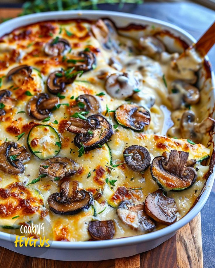 a casserole dish with mushrooms and cheese