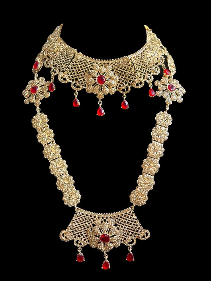 This is the perfect set to give yourself a royal look for your next special occasion! It comes as a full choker, long necklace, passa, earrings and tikka and can be worn separately for a lighter look! 3 Gorgeous colors to pick from ! Elegant Red Bridal Necklace For Ceremonial Occasions, Elegant Bridal Sets For Traditional Ceremonies, Elegant Bridal Sets With Tilla For Traditional Ceremonies, Bollywood Style Necklaces For Traditional Ceremonies, Red Bollywood Jewelry For Traditional Ceremonies, Bollywood Style Red Jewelry For Traditional Ceremonies, Elegant Heavy Necklaces For Traditional Ceremonies, Red Bollywood Style Ceremonial Necklaces, Ceremonial Red Bridal Sets With Stone Work