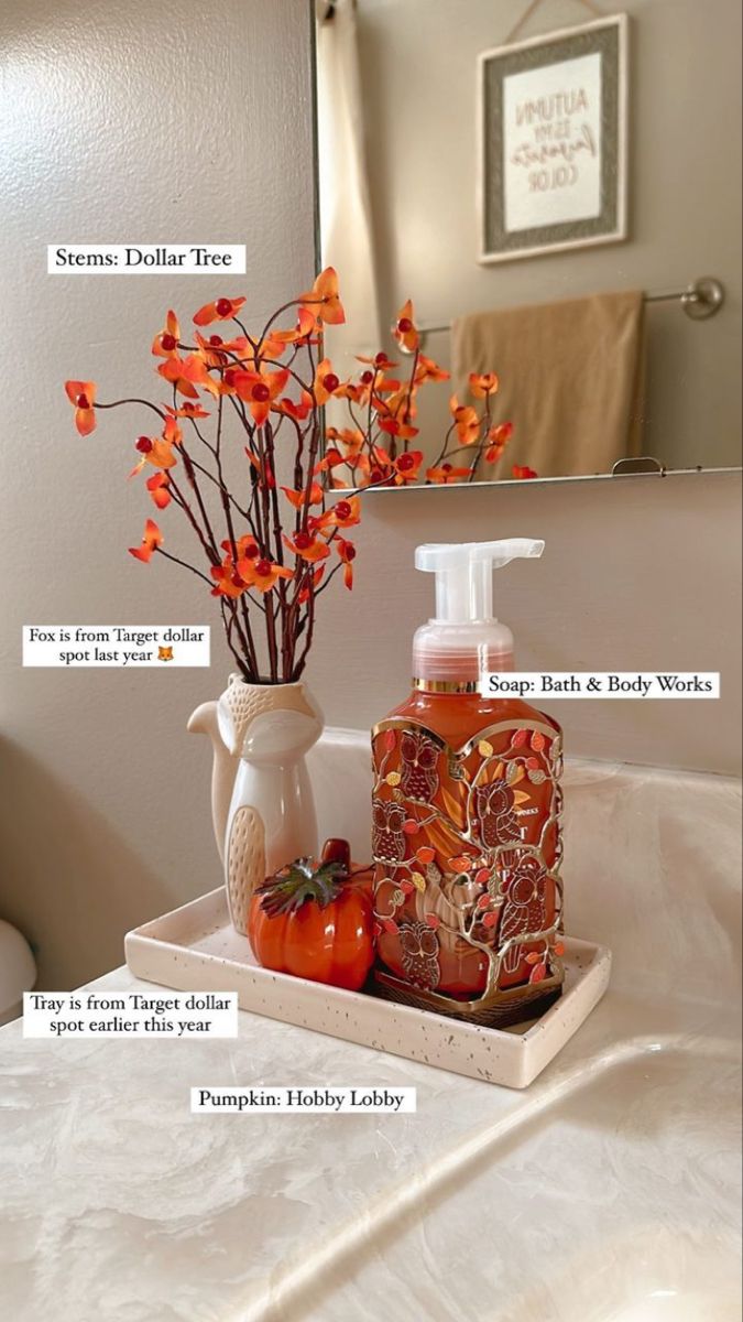 a bathroom with orange flowers and soap bottles on the counter top, along with information about how to use it