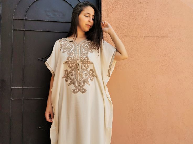 Beautiful moroccan white kaftan for women with fine embroidery. This long dress is handmade in soft fabric cotton which is very pleasant to wear. Its shape and its length refine the silhouette. Moroccan dresses have the double advantage of being comfortable and stylish too. For example it is an ideal clothing for pregnant women.  This white dress can be weared everywhere, indoor, outdoor... Or at a party/wedding with beautiful tuareg/berber jewelry and high heels : https://www.etsy.com/fr/shop/ChoukraneMarrakech?ref=seller-platform-mcnav&section_id=24615954.  This king of kaftan is without any doubt the most stylish design with butterfly sleeves.  This moroccan dress one size fit all body shape perfectly. This design can be weared with a belt if you want.  - Cotton ; - Fine embroidery - Co Embroidered Kaftan For Wedding, Elegant Maxi Kaftan With Chikankari Embroidery, Elegant Chikankari Embroidery Maxi Kaftan, Bohemian Abaya For Eid, Elegant Tunic-style Kaftan, Elegant Summer Tunic Thobe, Elegant Embroidered Tunic Kaftan, Bohemian Wedding Tunic, Resham Embroidery Tunic Abaya