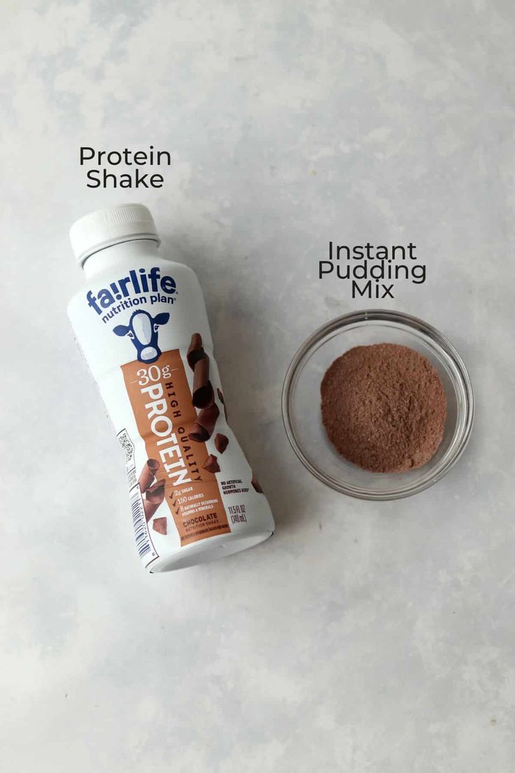 ingredients to make chocolate protein shake on a white surface with the words, protein shake instant pudding mix