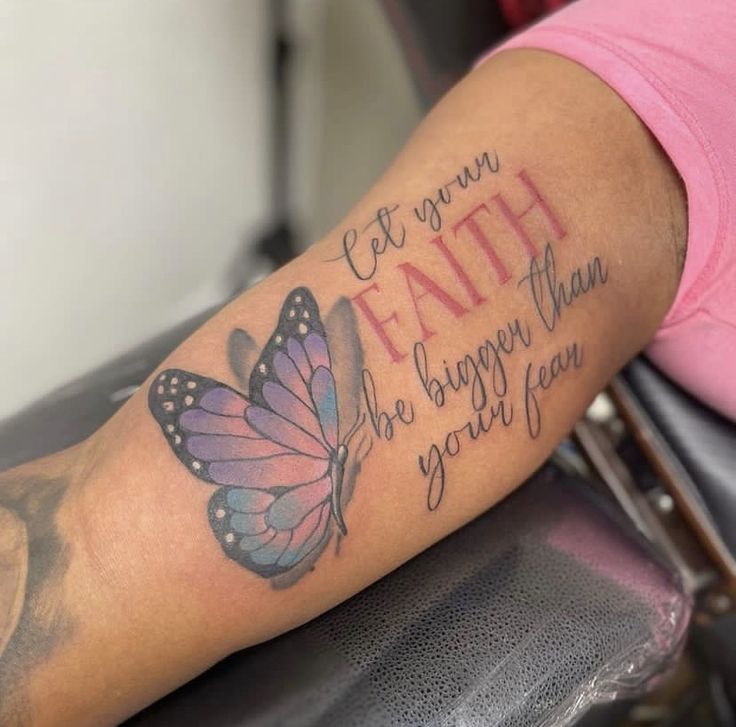 a woman with a butterfly tattoo on her arm that says, let your faith be bigger than you