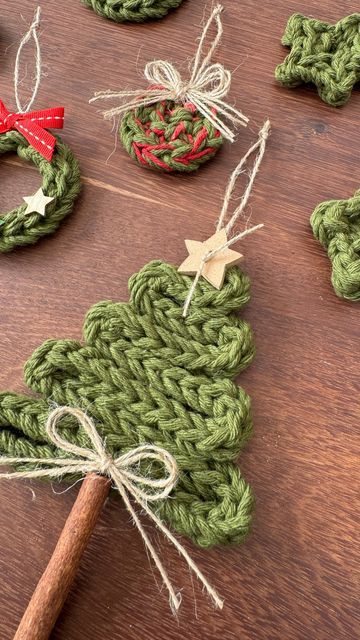 crocheted christmas tree ornaments on a wooden table