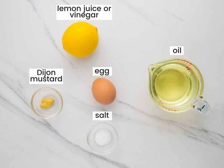 ingredients to make lemon juice or vinegar recipe on marble counter top with text overlay