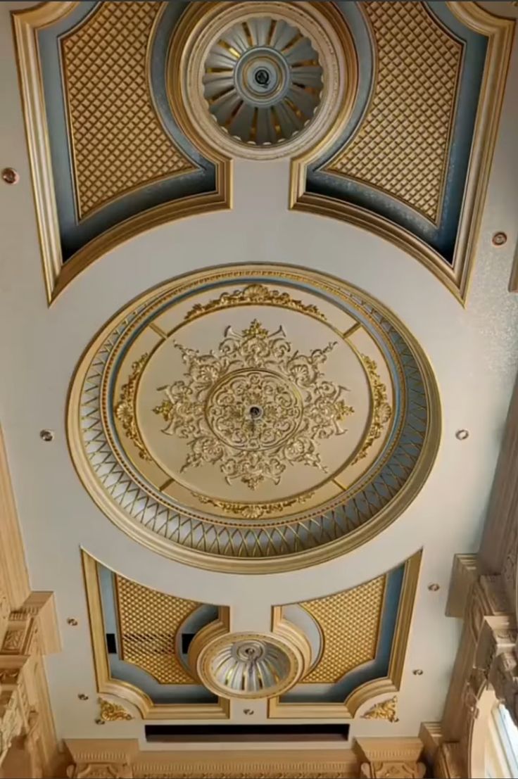 the ceiling is decorated with gold and blue