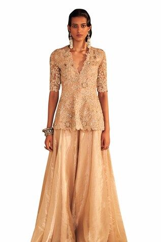 Champagne gold half sleeves cutwork borders peplum style kurta with all over florence embroidery using tonal sequins, cutdana and pearl highlights. Paired with a flared sharara crafted in tissue. - Aza Fashions Elegant Short Sleeve Festive Traditional Wear, Festive Elegant Traditional Wear, Elegant Short Sleeve Traditional Wear For Festive Season, Elegant Traditional Wear With Zari Work And Short Sleeves, Wedding Sets With Resham Embroidery And Short Sleeve, Elegant Sharara With Lace Work For Festive Season, Elegant Sets With Resham Embroidery And Short Sleeves, Elegant Sets With Resham Embroidery, Elegant Short Sleeve Sets With Resham Embroidery