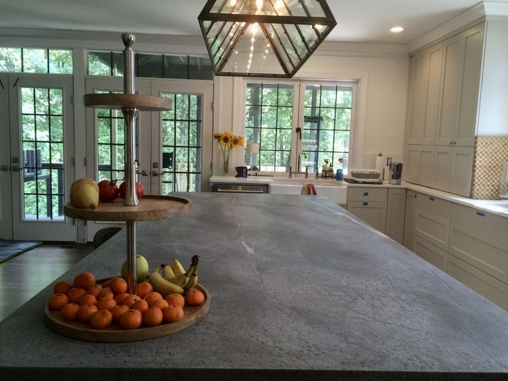 a large kitchen island with fruit on it