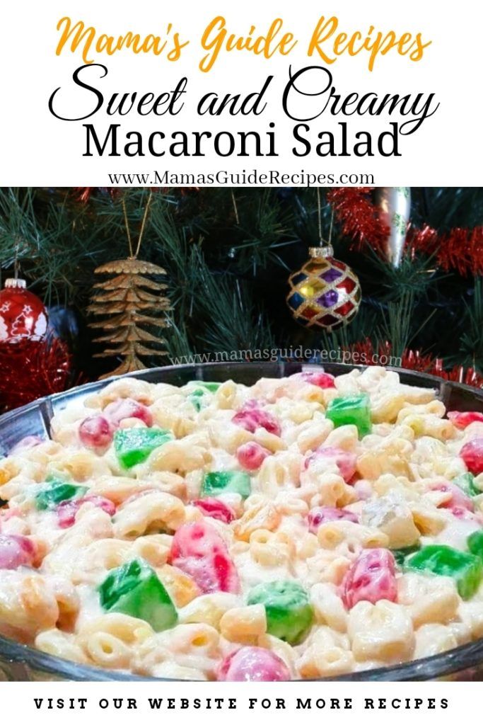 a large casserole dish filled with macaroni and cheese in front of a christmas tree