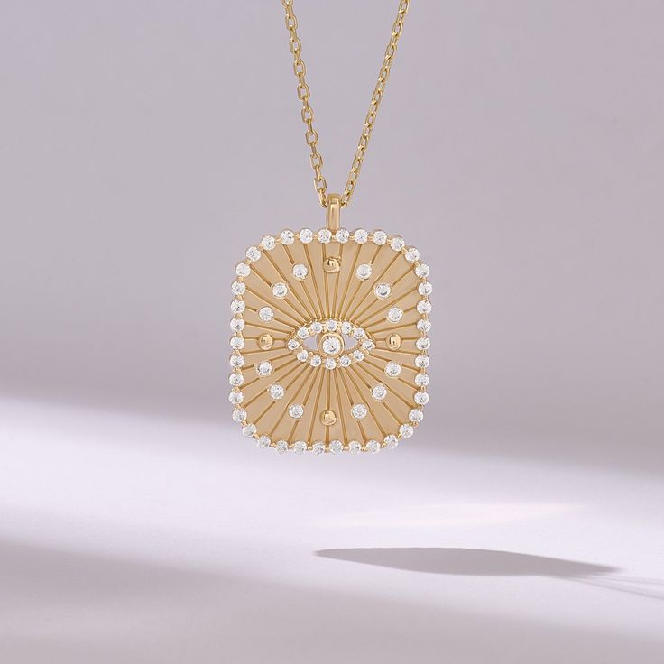 Introducing our captivating Unique Evil Eye Rectangle Necklace, meticulously crafted from 14k solid yellow gold. This eye-catching pendant features a striking rectangle design with the iconic evil eye symbol intricately adorned with pave diamonds, adding a touch of sparkle and elegance. Symbolizing protection and warding off negative energy, this handmade charm necklace is the perfect accessory for everyday wear, bringing both style and spiritual significance to your ensemble. 𝐈𝐭𝐞𝐦 𝐃𝐞𝐭𝐚? Fine Jewelry Diamond Necklace With Large Pendant As Gift, Gold Diamond Rectangular Necklace, Gold Diamond Necklace With Pearl Pendant, Gold Diamond Necklace With Rectangular Shape, Rectangular Gold Diamond Jewelry, Gold Cubic Zirconia Rectangular Pendant Jewelry, Diamond Necklace With Large Pendant As Gift, Gold Diamond-shaped Diamond Necklace, Diamond Rectangular Pendant Necklace As Gift