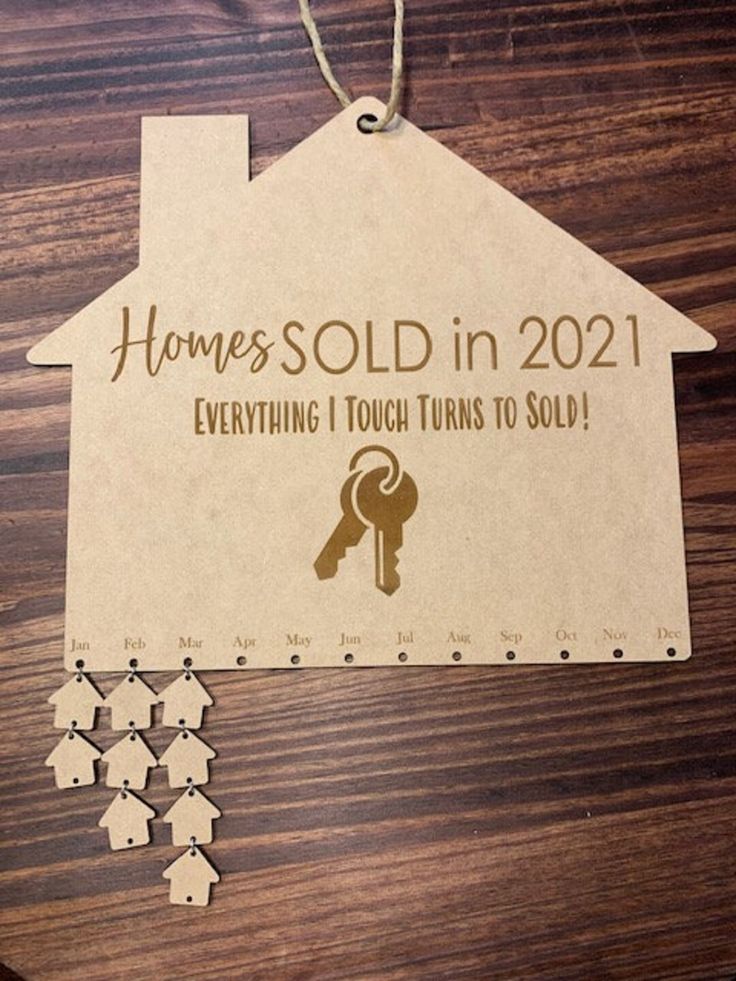 a house ornament that says, homes sold in 2021 everything i touch turns to sold