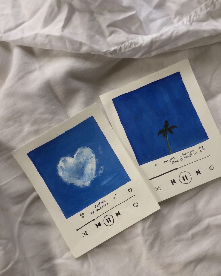 two pictures with blue and white designs on them, one has a palm tree in the shape of a heart