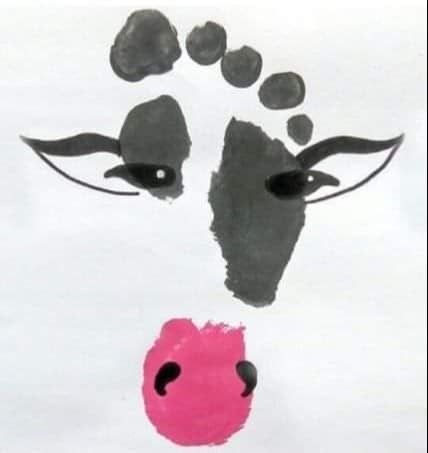 a drawing of a cow's face with pink nose